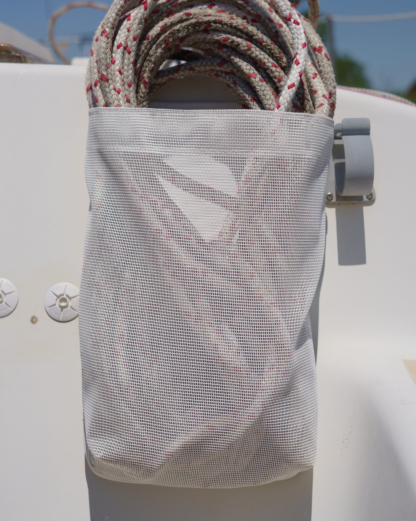 white mesh sailboat halyard bag