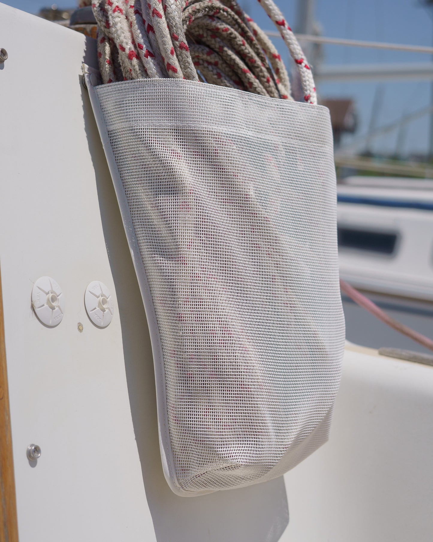 white mesh sailboat line and sheet bag